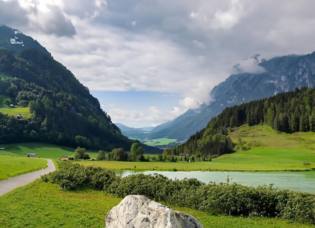 A mountain with a lake in the background