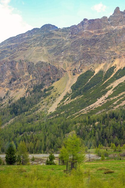 A mountain with a mountain in the background