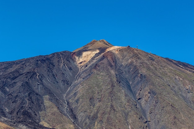 A mountain with a sign on it that says