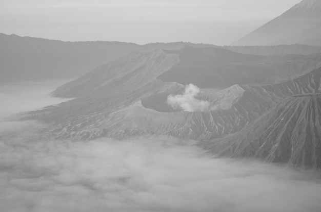 a mountain with a small cloud in the middle of it