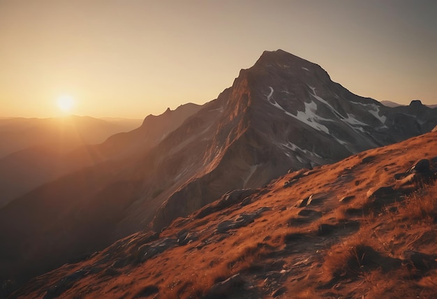 a mountain with the sun setting behind it