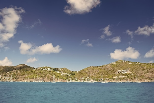 Mountain with yacht boat ship transportation in bay sunny summer