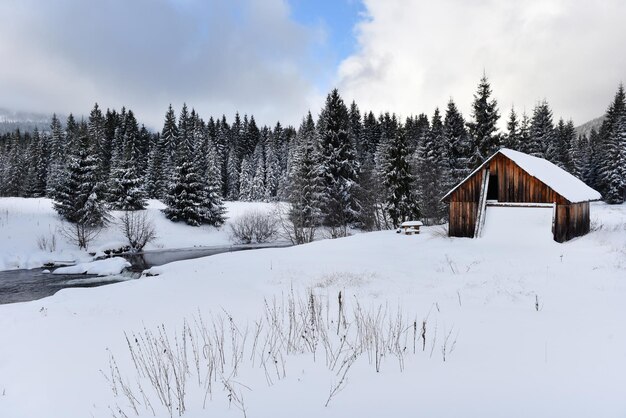 Mountain wooden chalet covered with fresh snow