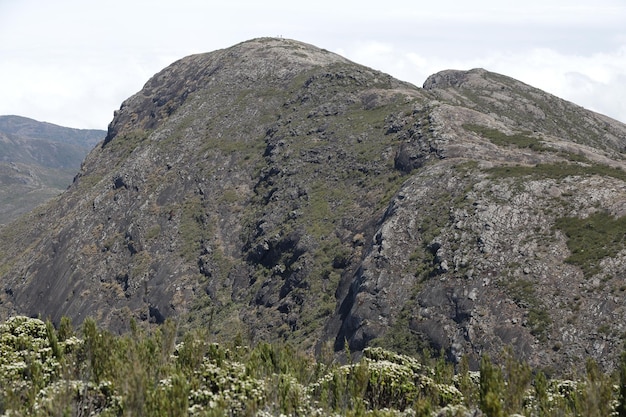 Mountaineer climbing brazil's highest peaks in the mountains with extensive hiking and backpacking.