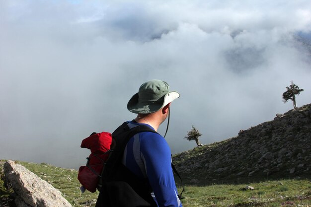 mountaineer and foggy hills