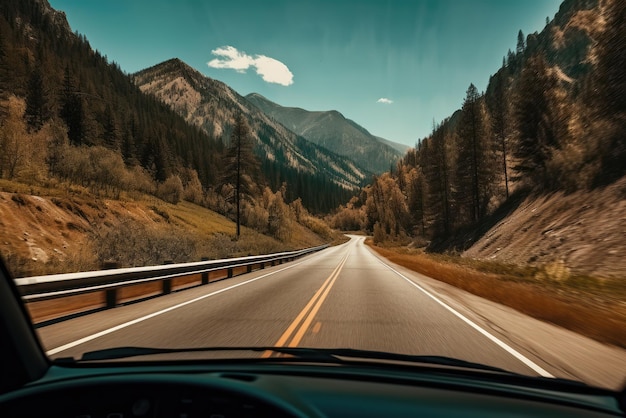 In mountainous environments with mountains You can see a remote highway from the car driving