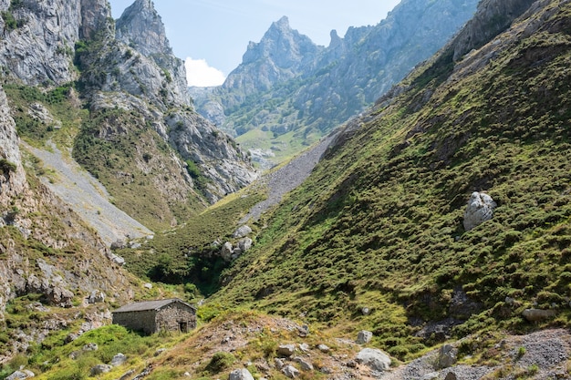 Mountainous landscape with stone house in the peaks of Europe, Asturias.