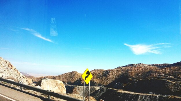 Mountains against blue sky on sunny day