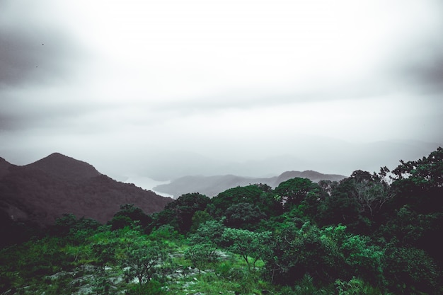 Mountains covered with raining clouds at the top of the mountain