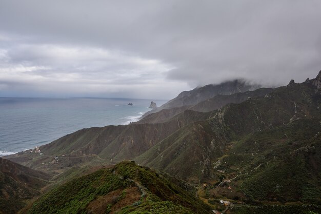 Mountains in the fog. mystical fog is approaching the mountains