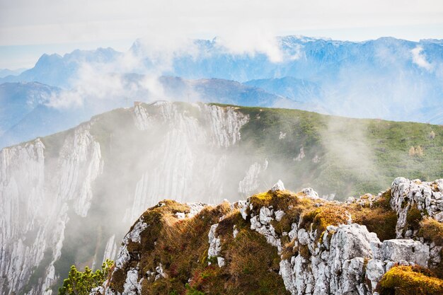 Mountains in foggy morning. Cable car on Feuerkogel ski resort, Austrian Alps