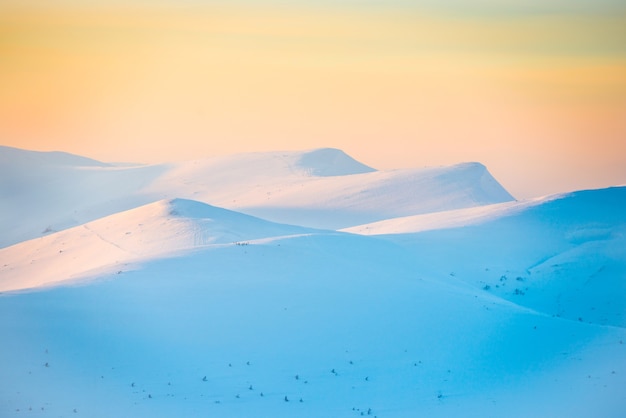 Mountains in snow. Landscape with sunset over hills