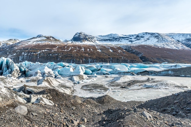 Mountains valleys and volcano around entrance of ice cave very famous landmark in Iceland travel