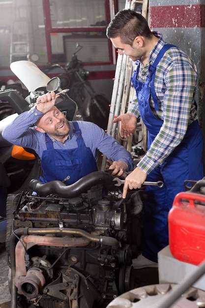 Mounting specialists in coveralls working