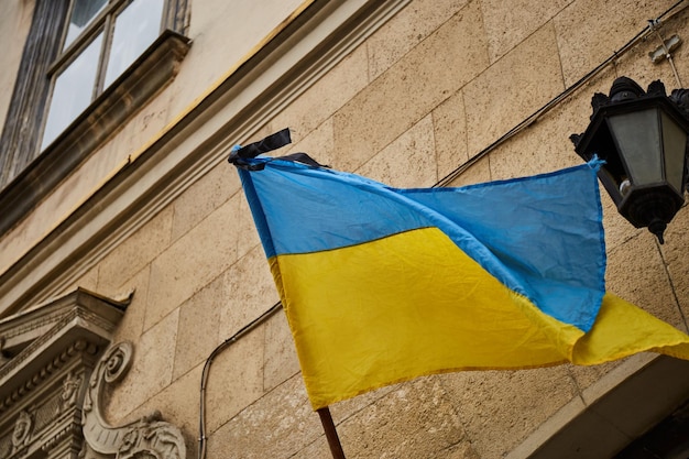 Mourning ukrainian flag in city building lviv during war