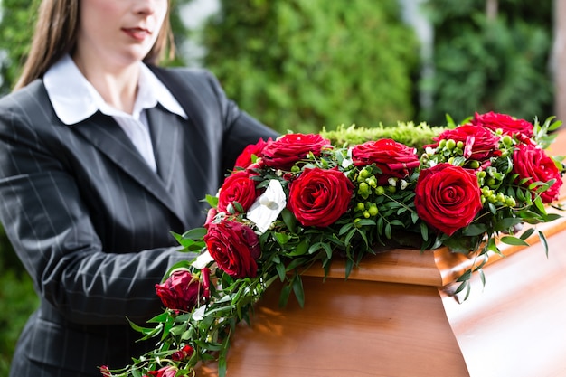 Mourning Woman at Funeral with coffin