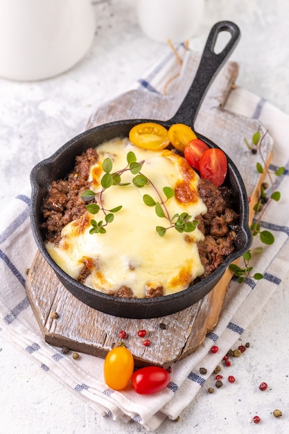 Moussaka. Traditional Greek dish. Chopped beef or lamb meat baked with eggplants, tomatoes and cheese.