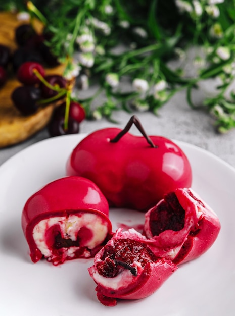 Mousse cake with mirror glaze and cherry filling