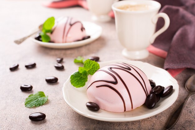 Photo mousse cakes covered with pink glaze