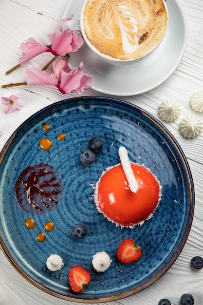 mousse dessert on a blue plate and a white background