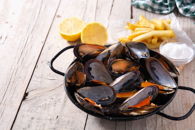 Moussels and french fries or molues-frites. Typical Belgian food.