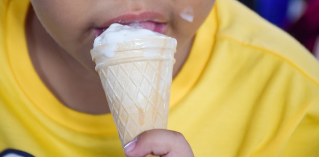 mouth of the children eat ice cream cones