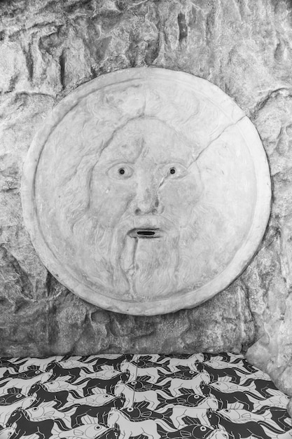 Mouth of truth sightseeing in Rome Italy Historical sculpture made of marble antique face full of mystery and legend