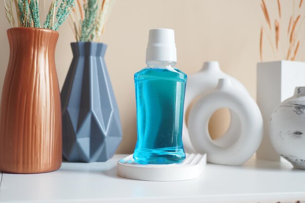 mouthwash liquid in a container on table