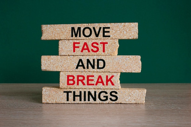 Move fast and break things Concept red words Move fast and break things on brick blocks