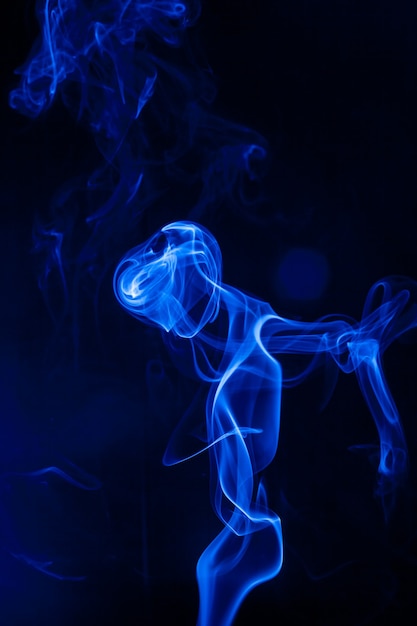 Movement blue smoke on black background.