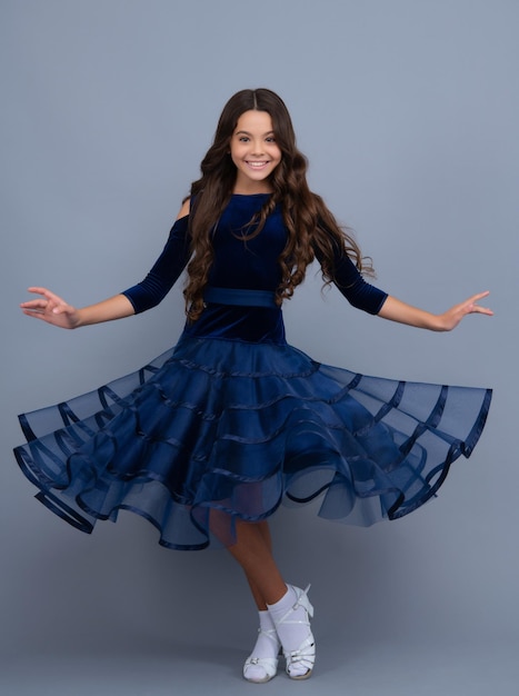 Movement dress of young child teen girl Full length of teenager child girl wearing ball dress Happy girl face positive and smiling emotions Movement skirt