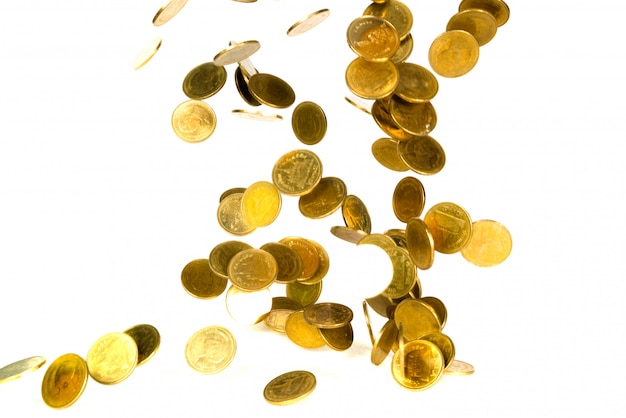 Фото Движение падающей золотой монеты на белом
