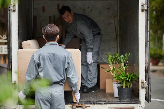 Photo movers loading furniture in van