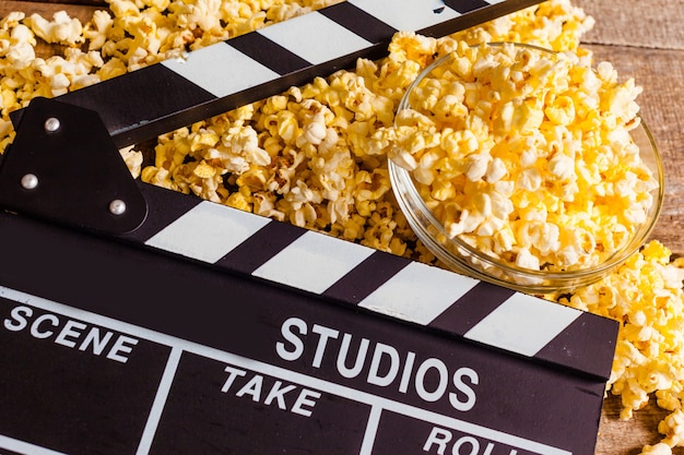 Movie clapper board and pop corn