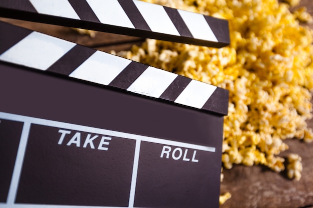 Movie clapper board and pop corn