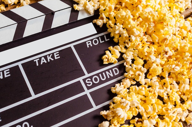 Movie clapper board and pop corn