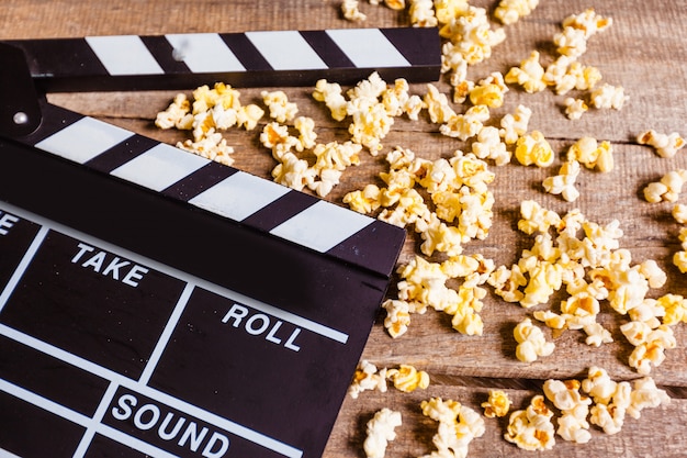 Movie clapper board and pop corn