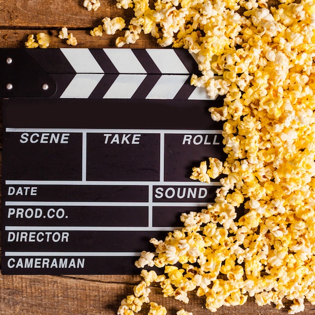 Movie clapper board and pop corn