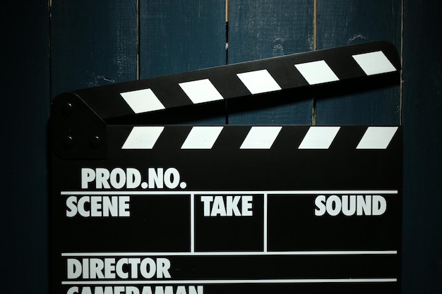 Movie clapper on wooden background