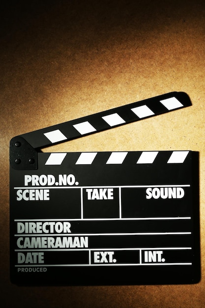 Photo movie clapper on wooden background