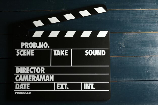 Photo movie clapper on wooden background