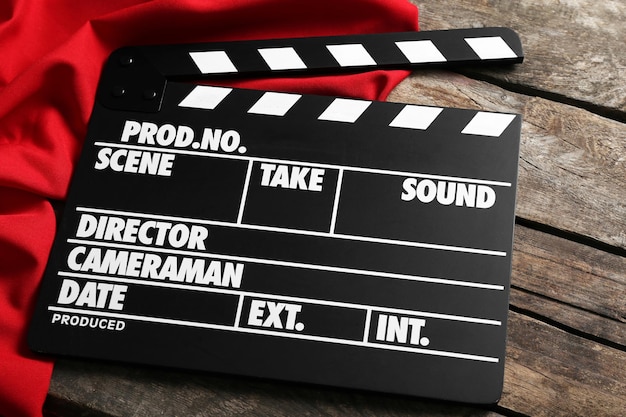 Movie clapper on wooden background