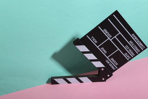 Movie clapperboard on bluepink background Minimalism Trendy shadow Creative layout