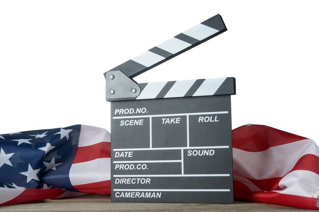 Movie clapperboard with American flag on the table