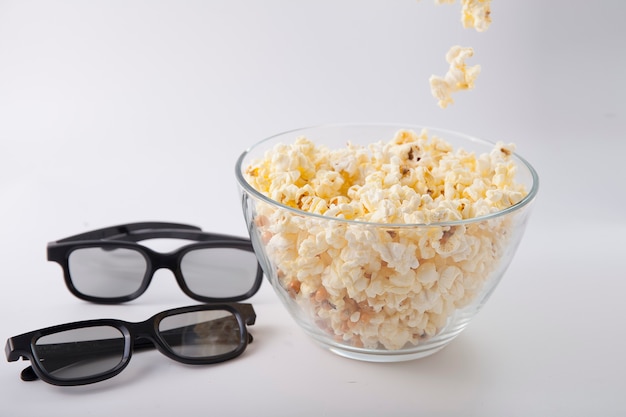 Movie items, 3D glasses and popcorn in a cup