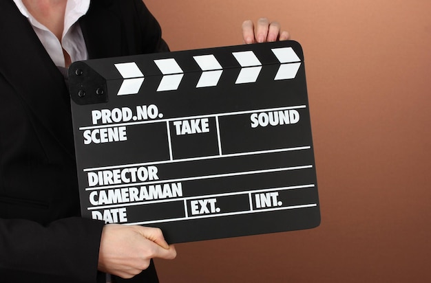 Photo movie production clapper board on color background