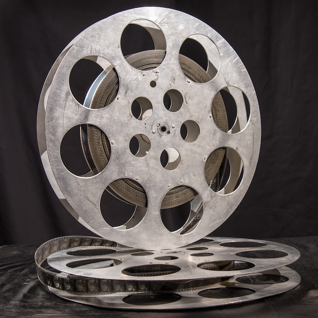 Movie reel on a black surface