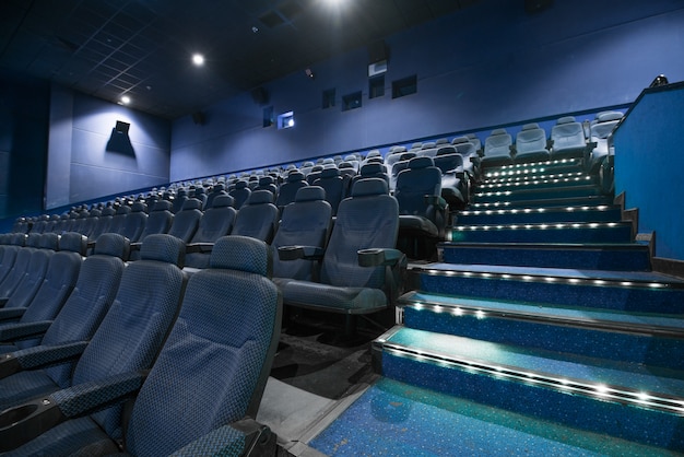 Movie theater empty auditorium with seats.