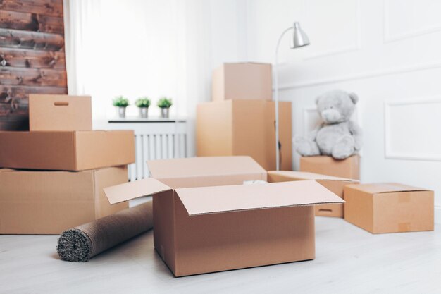 Photo moving concept room with cardboard boxes