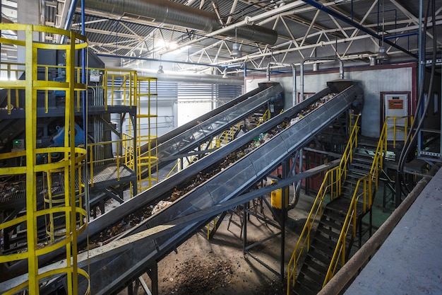 Moving conveyor transporter on Modern waste recycling processing plant Separate and sorting garbage collection Recycling and storage of waste for further disposal